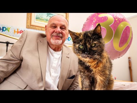 Man celebrates his cat's 30th birthday | SWNS