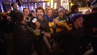 Australian journalist celebrates with Socceroos fans in Melbourne | AFP
