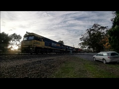 Triple NR Class Diesel locomotives head a freight train through the Adelaide Hills