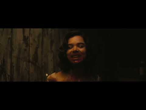 IMAX trailer still: close-up of resonator guitar under harsh stage light