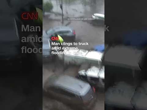 Man clings to truck amid extreme flooding in Chile