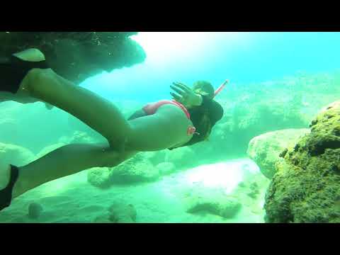 Bikini Girl Snorkeling Hawaii Cave