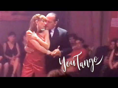 Lorena Ermocida  and  Oscar Martinez Pey  are  dancing  to  the  tango  "  A Los Amigos  "  by  Osvaldo Pugliese  in  2019