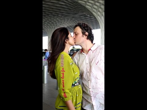 'All you need is love'- Shriya Saran's husband gives her a kiss at the airport