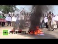 Pakistan: Protesters burn US and Israeli flags in ...