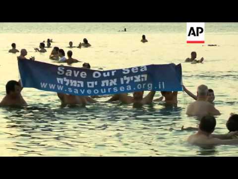 American photographer Spencer Tunick organises a 'mass float' shoot at dawn