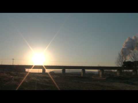 China steam, Pingzhuang, Mar.2, 2012 a SY pulling dozens of freighters loaded with coal in full.