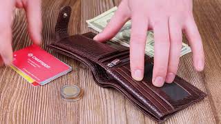 Місткий чоловічий гаманець з хлястиком із натуральної шкіри KARYA 21078 коричневий