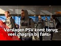 PSV-fans op Eindhoven Airport reageren, terwijl de selectie en de staf zwijgen na het pak slaag d...