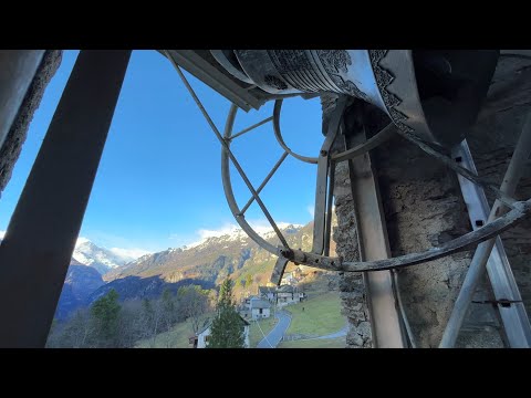 Bell ringing in Trasquera (Italy) and the mountain landscape on Christmas Eve