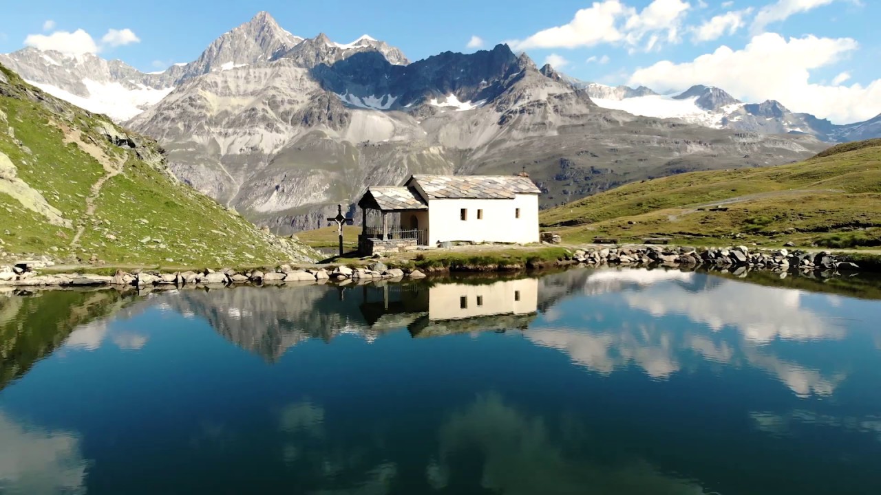 Behold the tranquil splendor of Schwarzsee Lake, a true alpine gem.