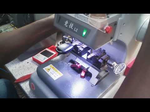 Cutting a Toyota key with out high precision key cutting machine.