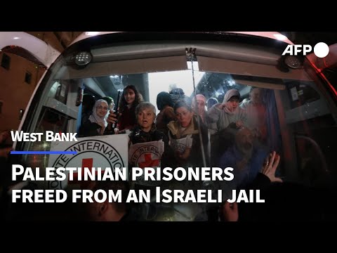 Crowds cheer as freed Palestinian prisoners arrive in West Bank town | AFP