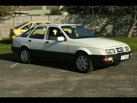 Ford Sierra XR8 blasts by a 1966 Mustang