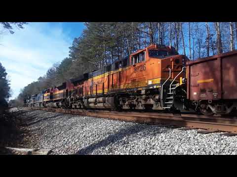 NS 8911 leading NS 119 thru Downtown Gainesville, Ga with colorful lashup on 2/2/18