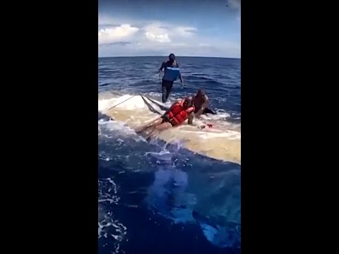 U.S. Coast Guard rescues 49 from makeshift capsized boat