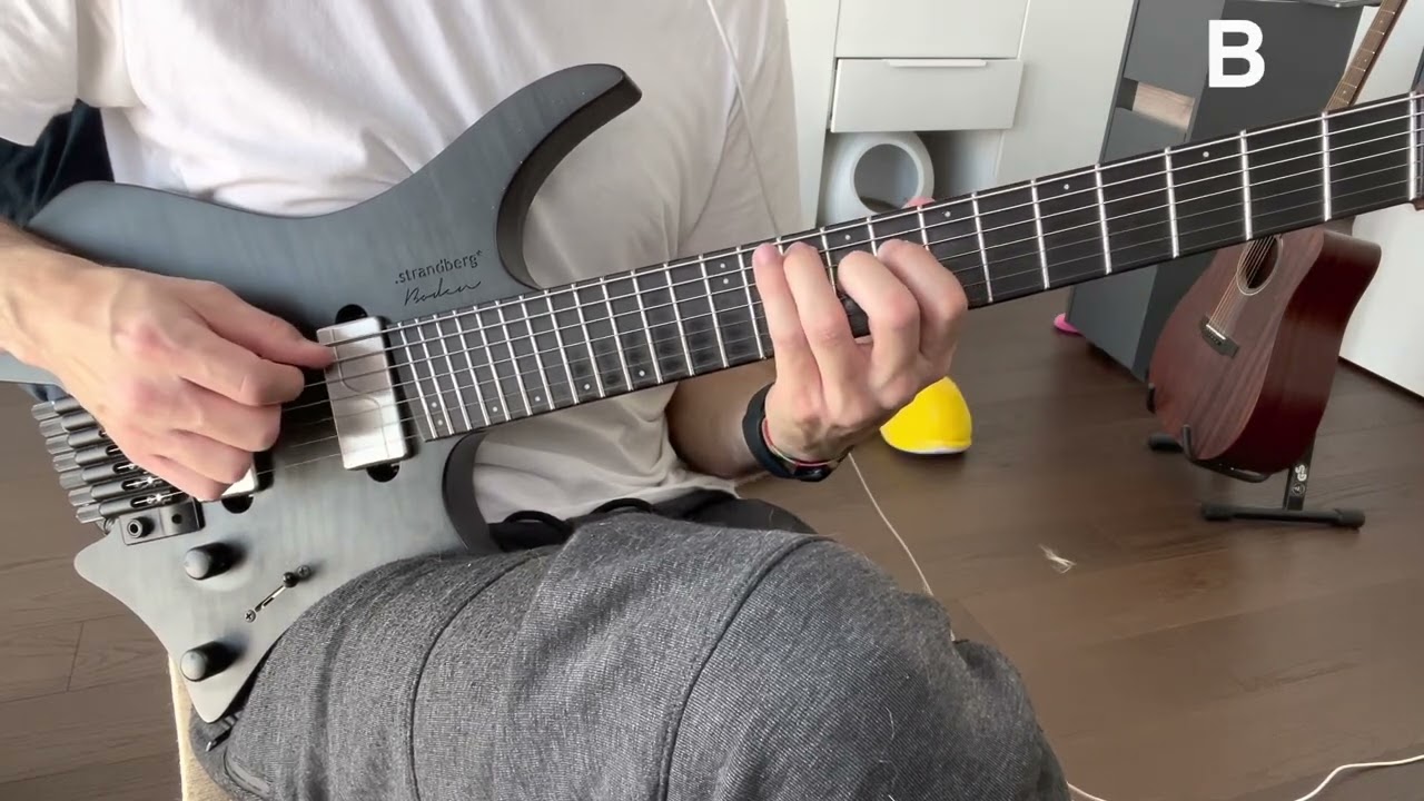 Guitarist demonstrating diminished triad voice leading on the D, A and E strings
