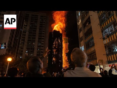 Hong Kong fire death toll rises to 55 as towers burn for a second day
