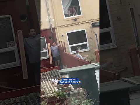 Angry UK neighbors hurl planks of wood at each other