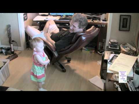 Granddad talking in fluent baby with baby.