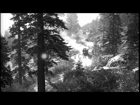 Motor convoy drives through the Sierra Nevada mountain range and stops in Kybury HD Stock Footage