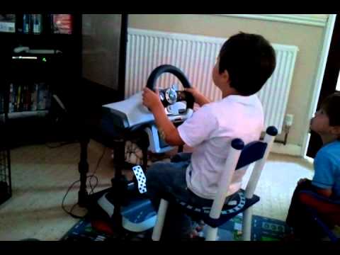 My  4 year old son doing Forza 3 with wheel