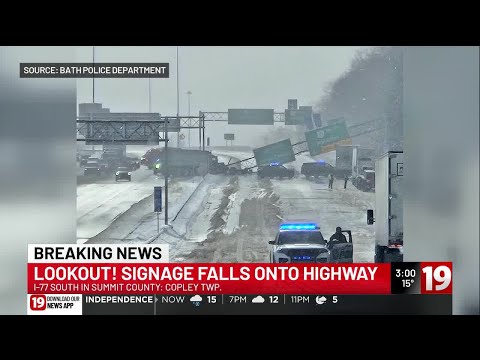 Semi-truck crash knocks down overhead sign on I-77