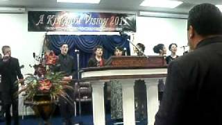 Youth choir singing Power In The Name Of Jesus.avi
