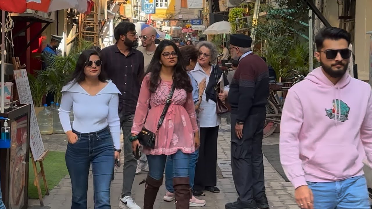 Immersive street-level walking tour through Khan Market is an OVERRATED PLACE - New Dheli, India, showcasing authentic urban landscapes, local architecture, and the vibrant atmosphere of the city's neighborhoods
