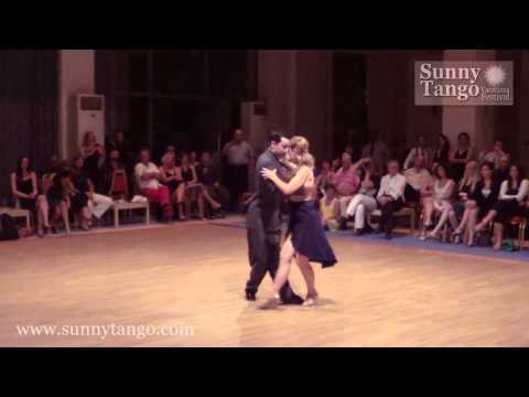  Elli Karadimou  and  Gabriel Marino  are  dancing  to  the  tango  "  Oigo Tu Voz  "  by  Ricardo Tanturi  at  Sunny Tango Festival  in  2014