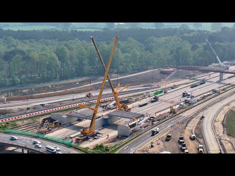 M25/A3 Wisley Junction 10 - New roundabout bridge beam installation by drone in time-lapse x5 speed.