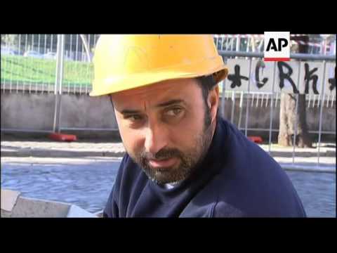 Workers worry that Berlusconi's resignation will not change much