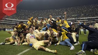 Los Tigres sacaron ventaja de 1-0 en el Universitario, pero las Águilas aplastaron 3-0 a los felinos en el Azteca con goles de Michael Arroyo, Oribe Peralta y Paul Aguilar para conseguir su título número 12.