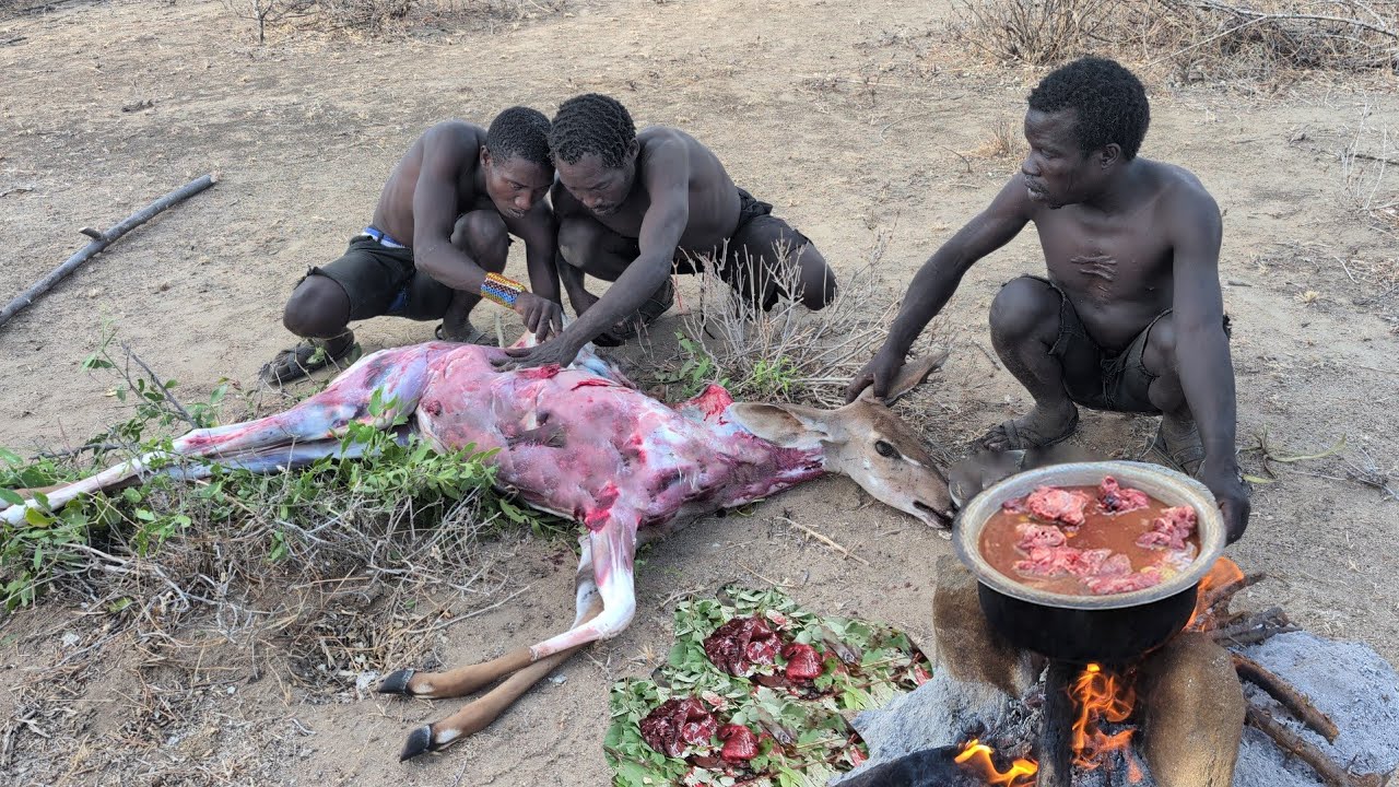 Hadza morn hunting and cooking their lunch