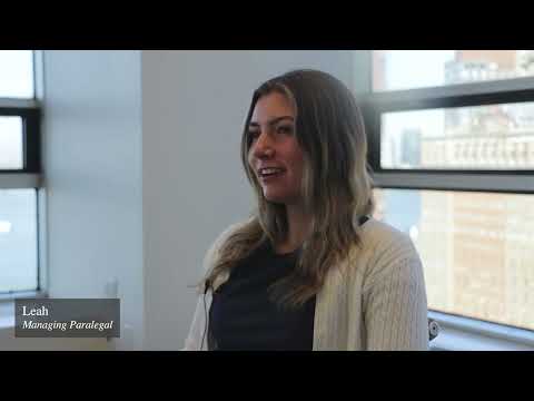 “Everyone here looks out for everyone. There’s no real hierarchy. It’s very much everyone in a community … and I have had the lovely experience of getting to work with the most impressive attorneys in all of New York” – Leah Markbreiter, Managing Paralegal testimonial video thumbnail