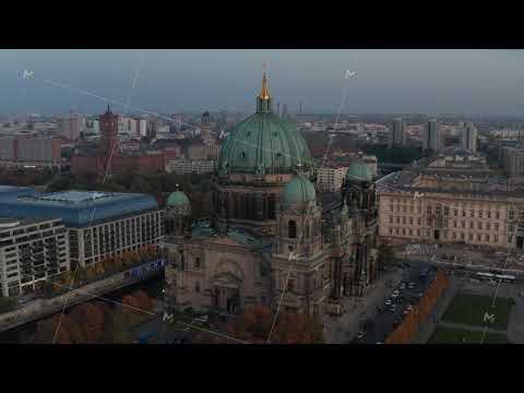 AERIAL: Circling Berlin Cathedral and streets in background, Germany in Fall colors at beautiful