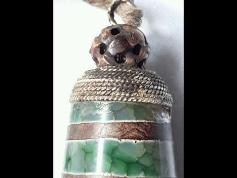 西藏三千多年前古象雄文明時期苯教的聖物深綠色鑲寶石九眼古象雄老天珠 Dark green gem-inlaid nine-eyed ancient Zhangzhung old dzi bead