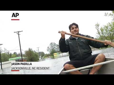 A neighborhood hard hit by Florence near Jacksonville, North Carolina was submerged in high flood waters Sunday. A local resident took an Associated Press journalist on a tour in his canoe. (Sept. 16)