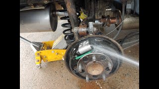 How to replace E brake cable on a Honda Civic and rear brake shoes.