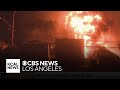 Large flames from Palisades Fire rip through multiple homes.mp4