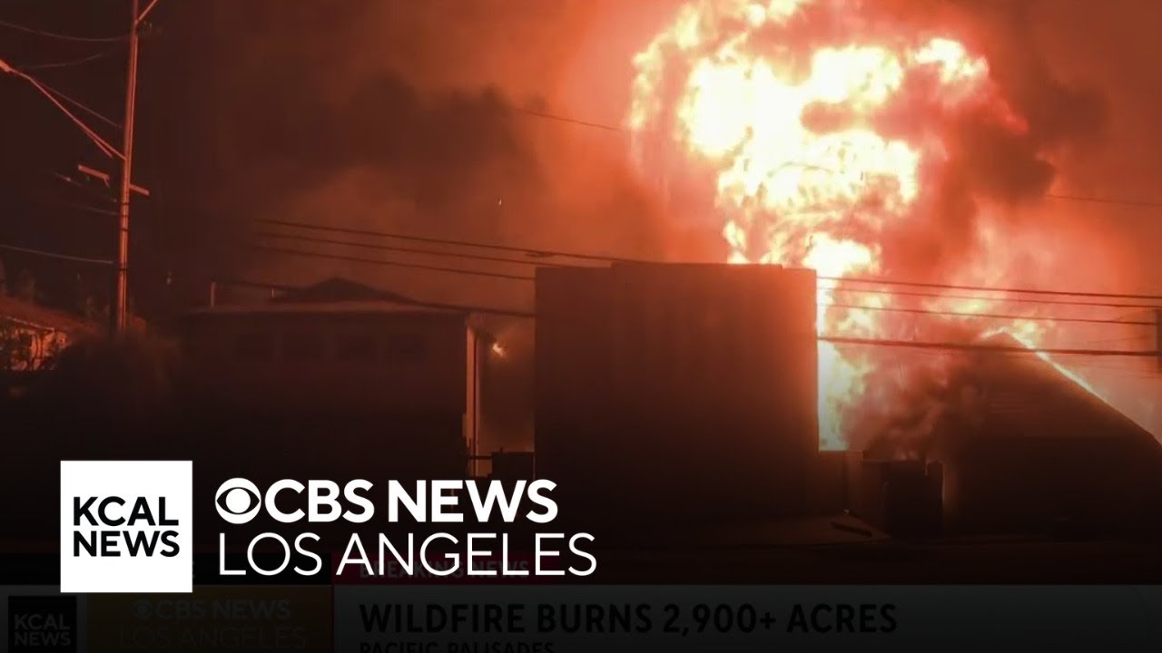 Large flames from Palisades Fire rip through multiple homes