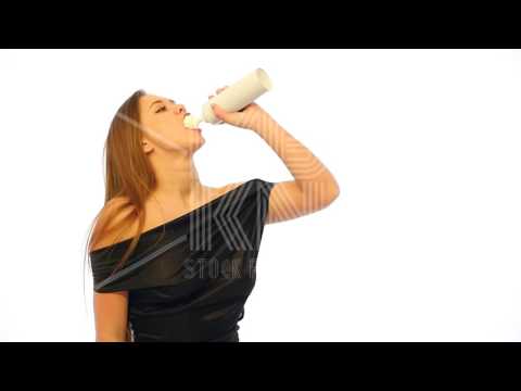 Girl Spraying Whipped Cream into Her Mouth