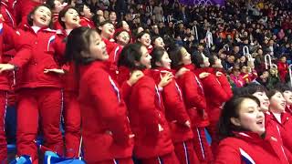 North Korean Cheerleaders displaying their choreographed cheers to charm the crowd