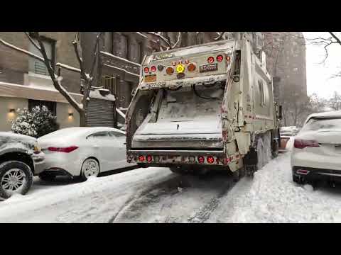 DSNY GARBAGE TRUCK PLOWING THE STREETS OF NEW YORK CITY DURING WINTER STORM KENAN.