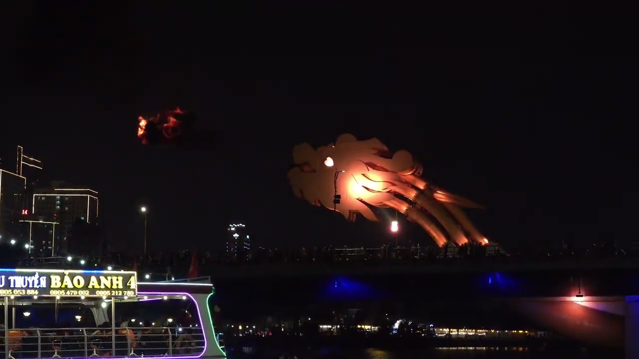 Witness a mesmerizing fire show lighting up the night sky as seen from the Da Nang Han River Cruise.