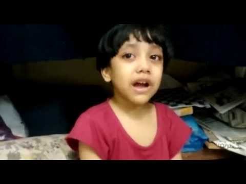 Struggling to stop Khadijah from touching a cat (8th Nov 2015 @ 3AM)