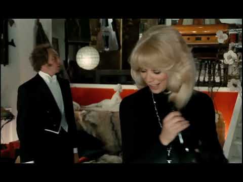 Mireille Darc in Guy Laroche. 'Le Grand Blond avec une chaussure noire', 1972.