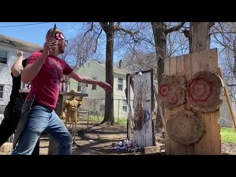 Duo Pins Cans on Target Board in Sync While Knife Throwing - 1128233-2