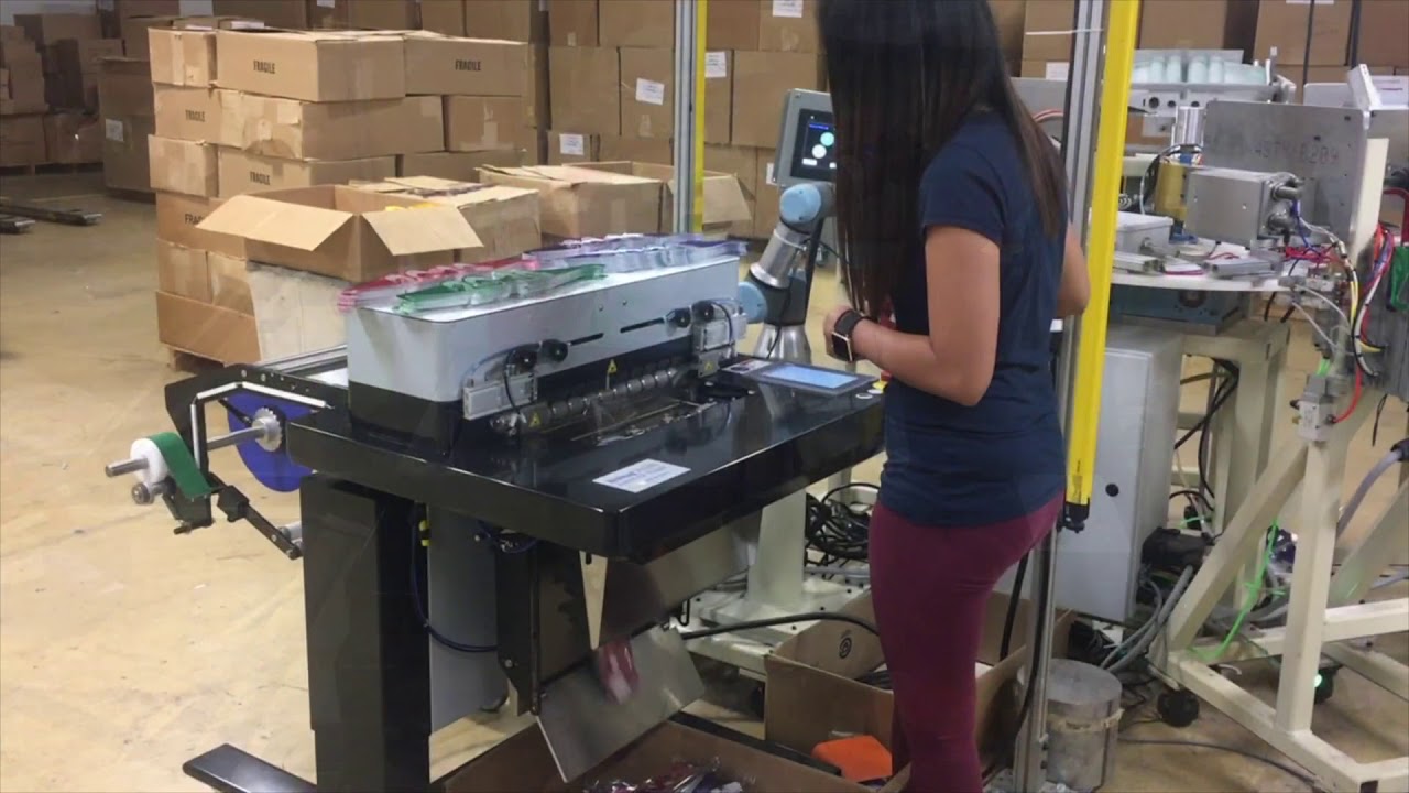 Collaborative Robot Working With Rollbag R3200 Automatic Bagger
