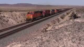 preview picture of video 'BNSF Needles sub - Grain train with lots of power ascends Ash Hill.'